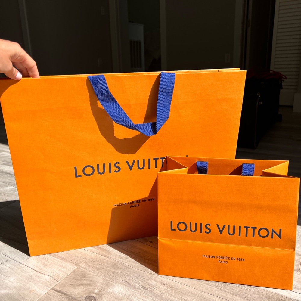 10” by 8” Authentic Louis Vuitton paper bag.